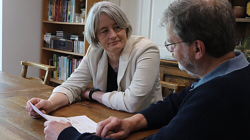 Claire Young speaking to a resident about their energy bill