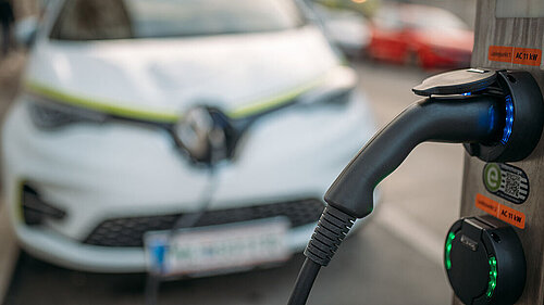 Car charging in street Car charging in street