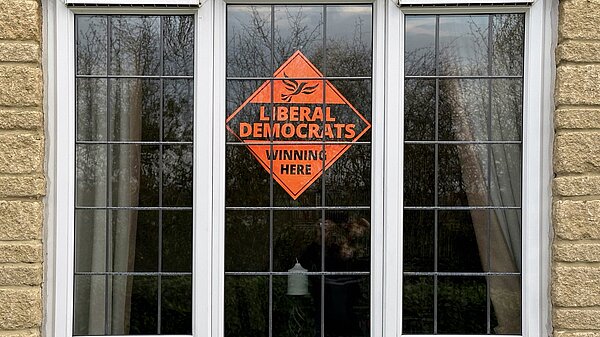 A Lib Dem window poster