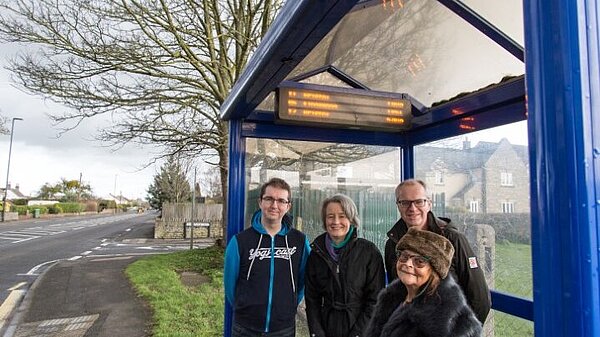 The team by the bus stop